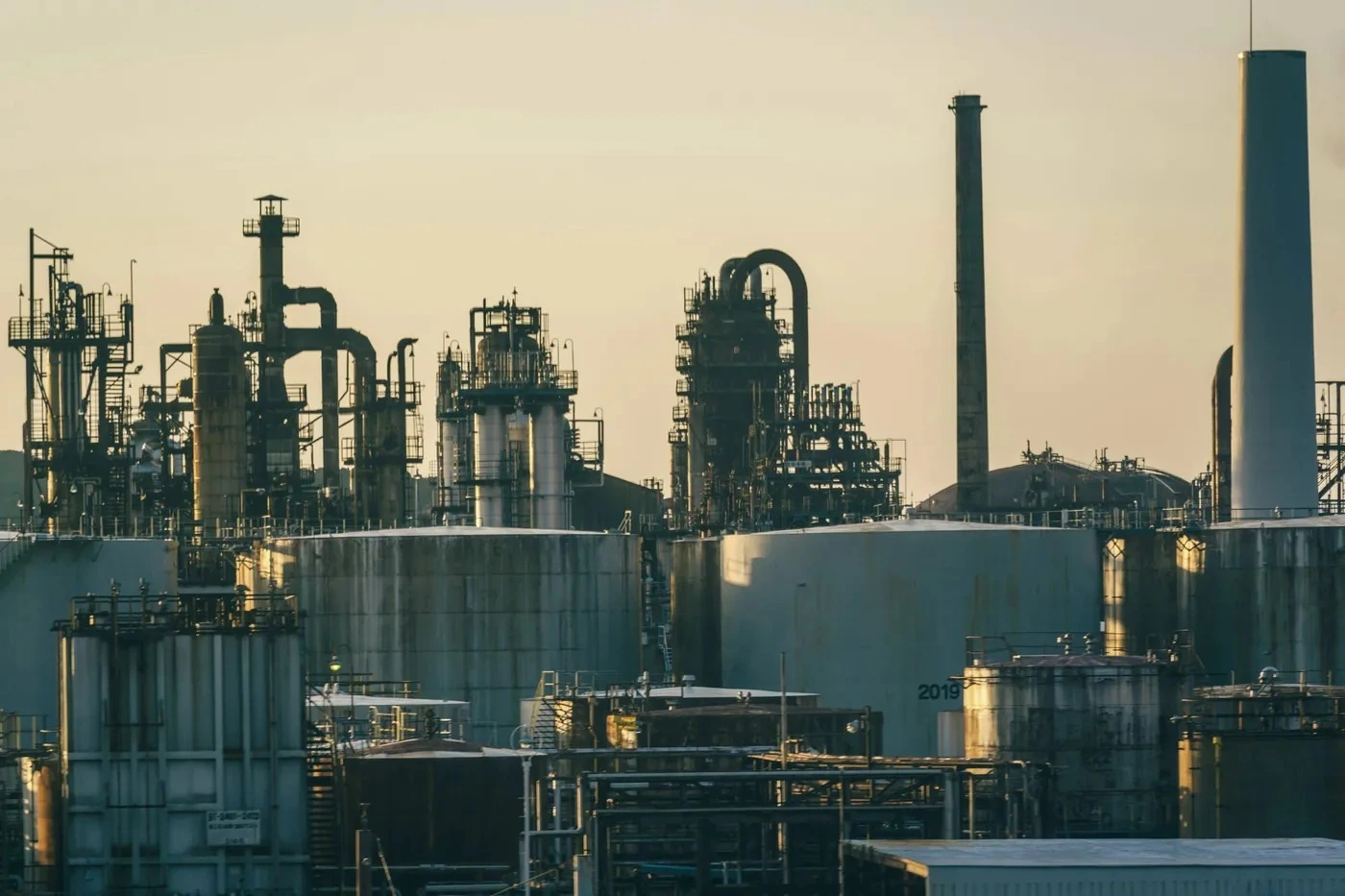 Refinery and tanks at sunset